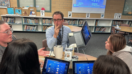 A group of faculty members engage in a heated discussion during a mission.